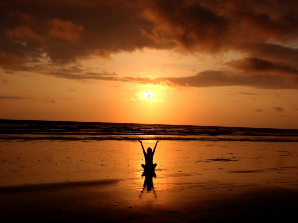 pexels-photo-268134 Peaceful meditation silhouette at sunset on a serene beach.