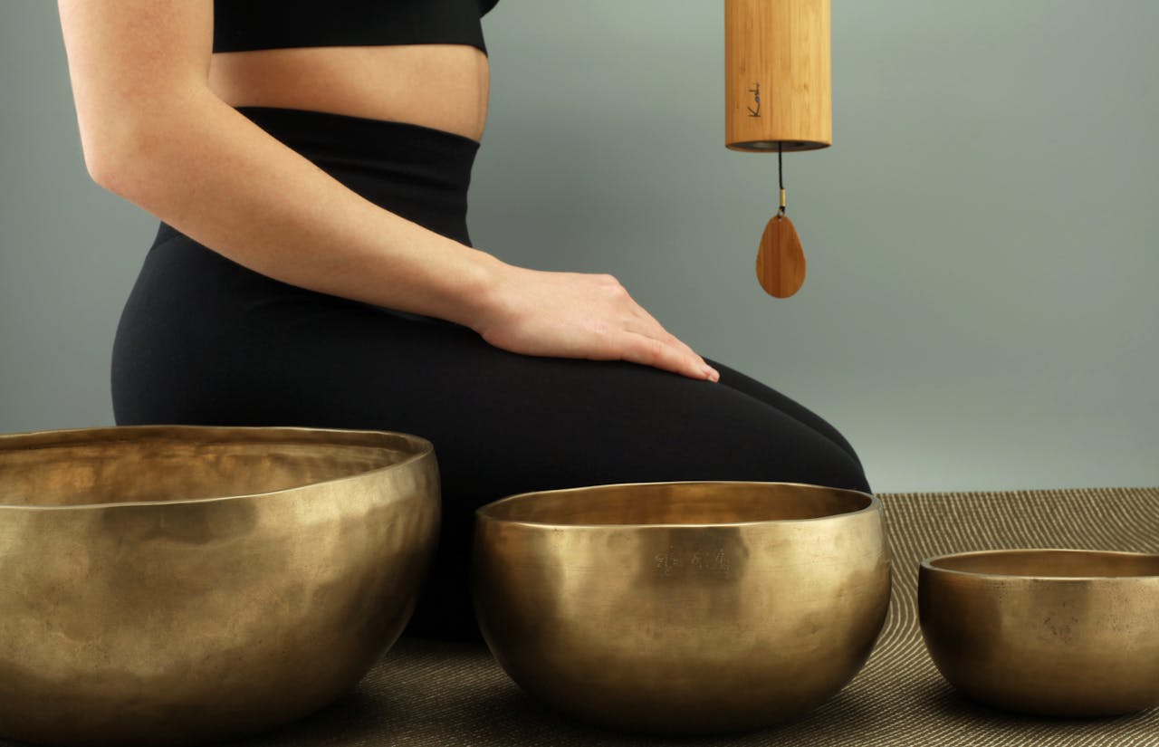 A tranquil scene featuring meditation with Tibetan singing bowls for relaxation and healing.